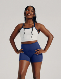Front view of model wearing the Teen Leakproof Active Short highlighting the coverage and fit