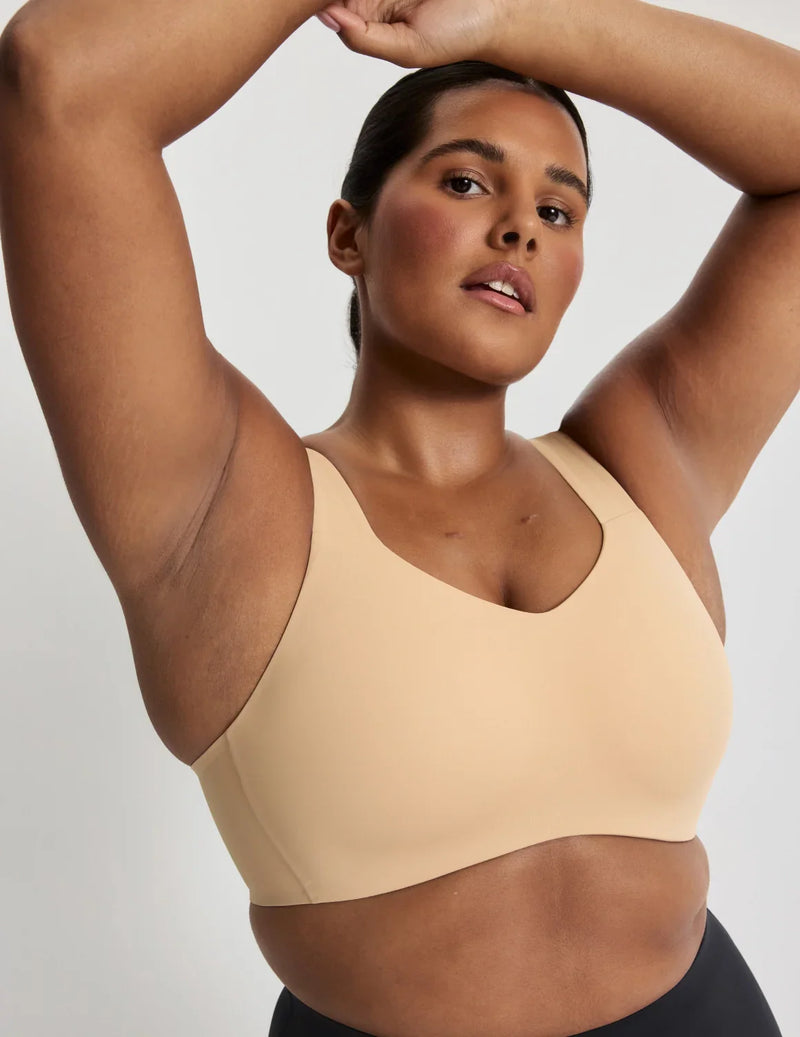 Adiya is a 36C and wears a Knix size L  | Warm Sand