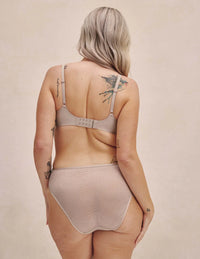 Front view of model highlighting the coverage and fit