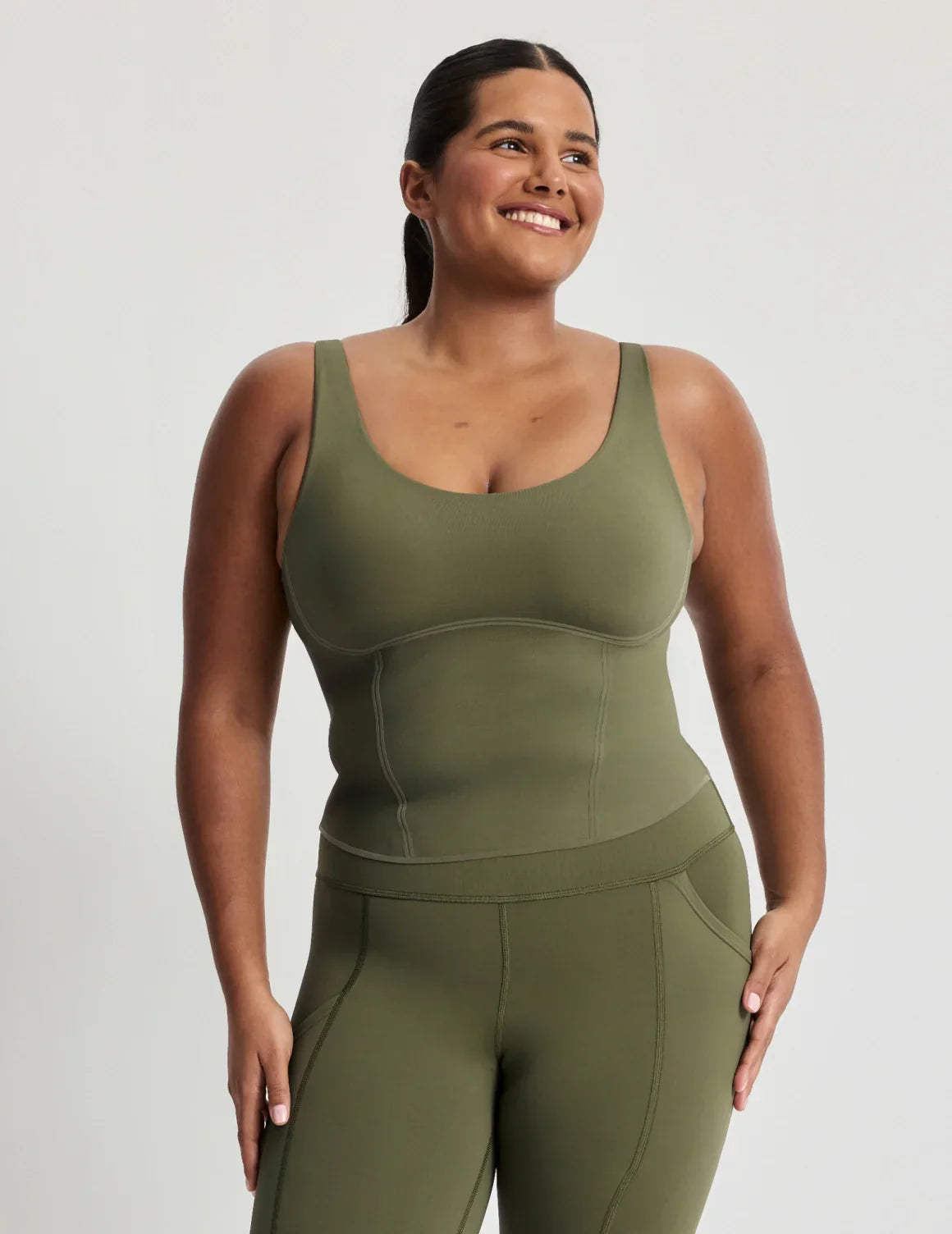 Adiya is a 36C and wears a Knix size L | Olive