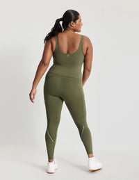 Adiya is a 36C and wears a Knix size L  | Olive
