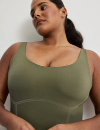 Adiya is a 36C and wears a Knix size L  | Olive