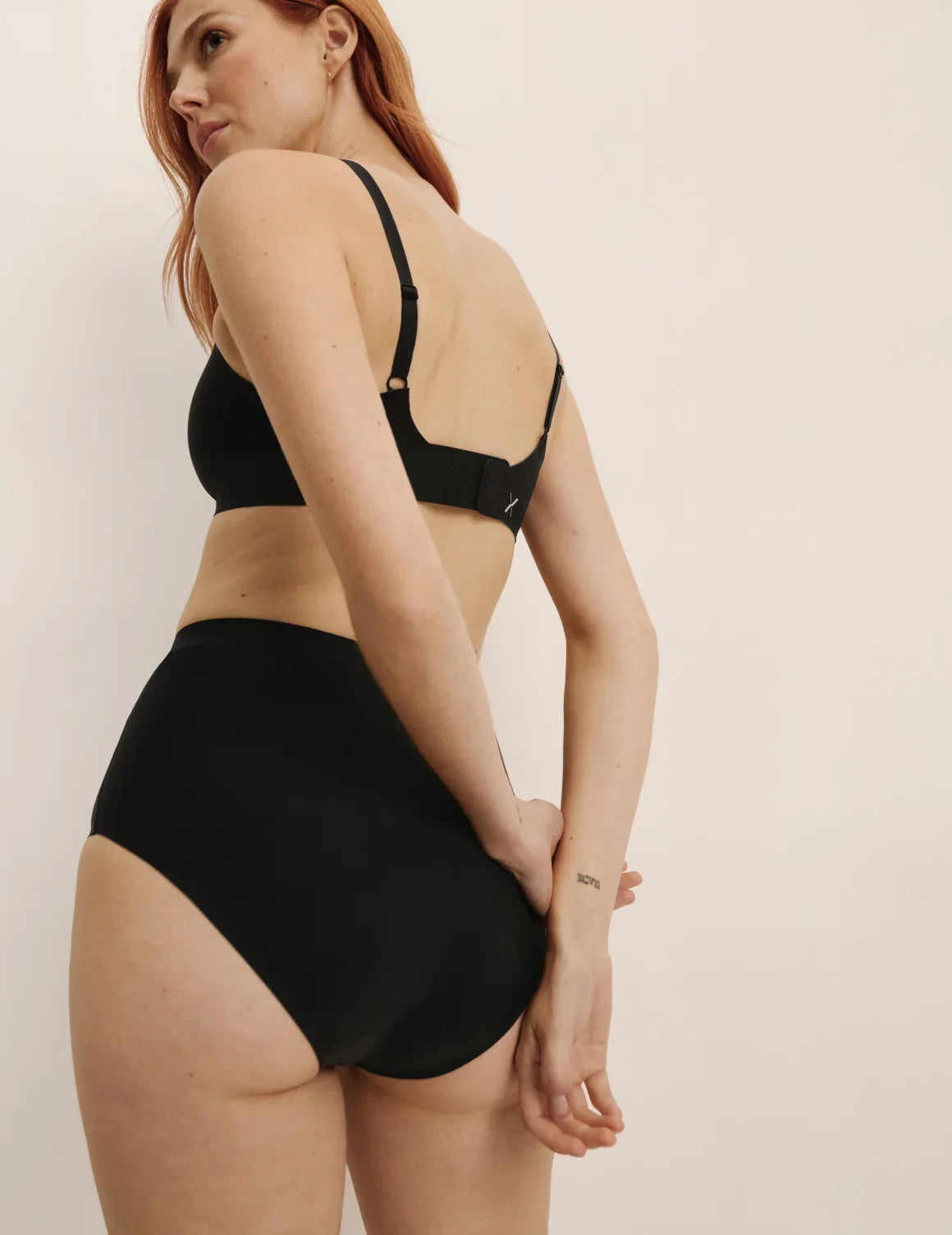 Molly has 35.5” hips, and wearing KNIX S | Black