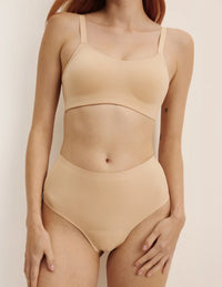 Molly has 35.5” hips, and wearing KNIX S | Warm Sand