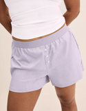 Binta has 44” hips and wears KNIX L | Lavender Stripe