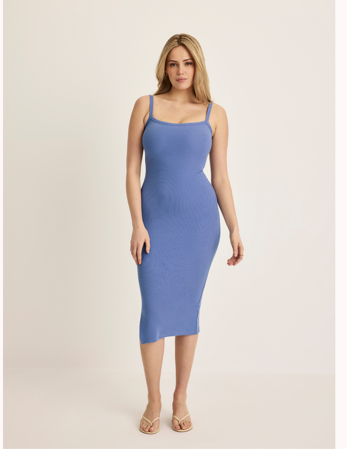 Sarah is a 34DD, has 38.5” hips, and 5’9.5” tall wearing KNIX M | Front view of model wearing the SculptRib™ Cotton Cami Dress highlighting the neckline, fabric and hugging fit | Periwinkle