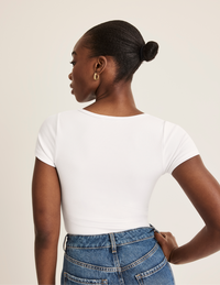 Orlane is a 32DD wearing KNIX S | White