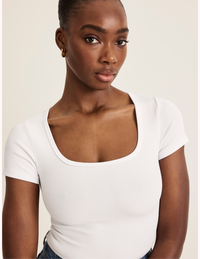 Orlane is a 32DD wearing KNIX S | White