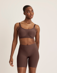 Full-body view of model wearing the Thigh Saver® 6” highlighting the coverage and smooth fit