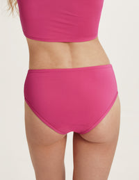 Back view of model wearing the Teen Period Swim Full-Coverage Bikini Bottom highlighting the coverage and fit