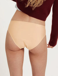 Front view of model wearing the Teen SuperPlus Leakproof® No-Show Bikini highlighting the coverage and smooth fit