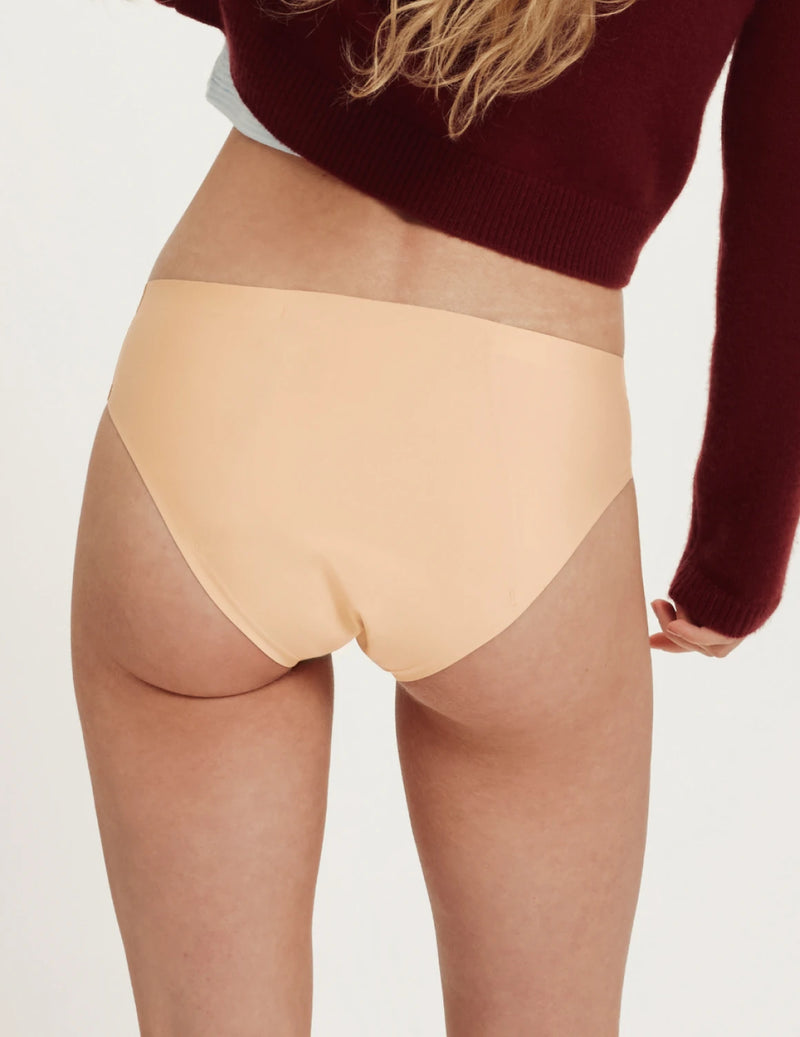 Front view of model wearing the Teen SuperPlus Leakproof® No-Show Bikini highlighting the coverage and smooth fit