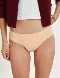 Front view of model wearing the Teen SuperPlus Leakproof® No-Show Bikini highlighting the coverage and smooth fit