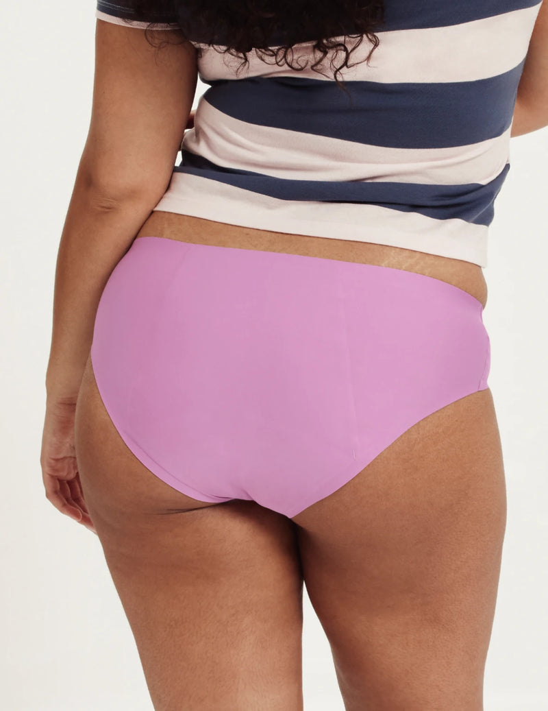 Front view of model wearing the Teen SuperPlus Leakproof® No-Show Bikini highlighting the coverage and smooth fit