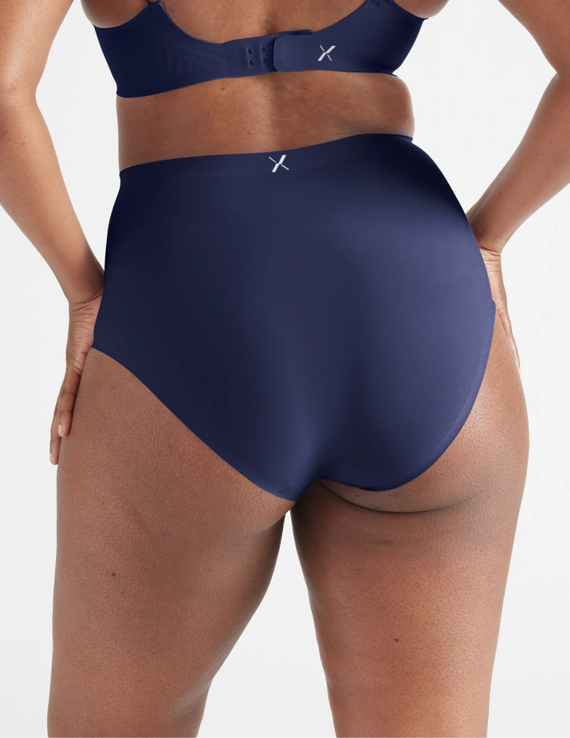 Back view of model wearing the Light Leakproof No-Show High Rise highlighting the coverage and smooth fit