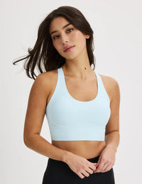 Front view of model wearing the Longevity Sports Bra, highlighting the neckline, strap design, and silhouette