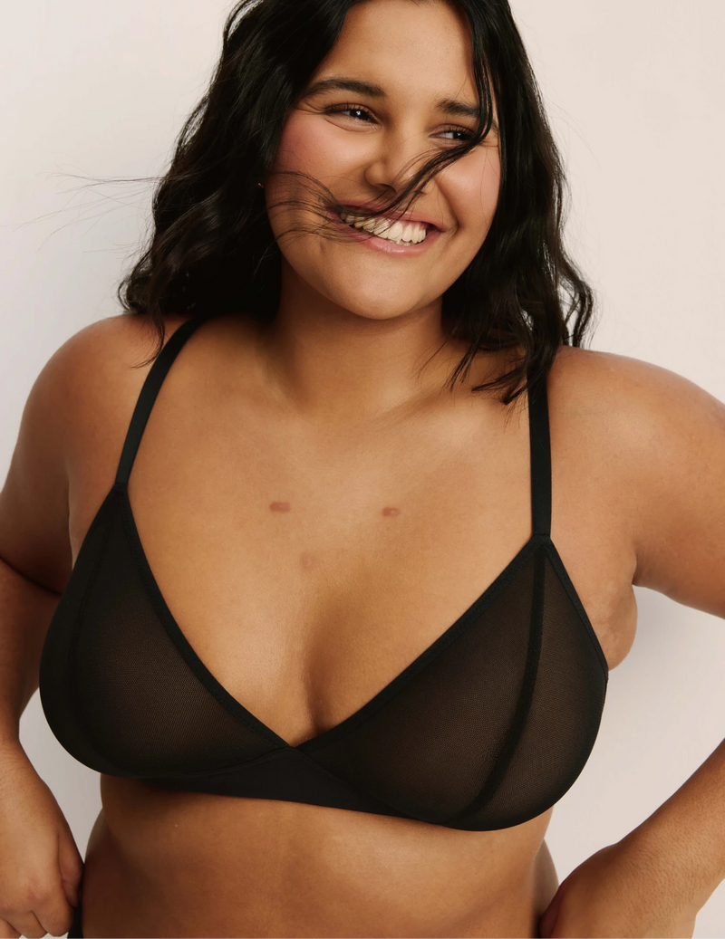 Front view of model wearing the Mesh Deep V Bra, highlighting the neckline, strap design, and smooth silhouette