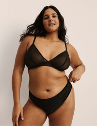 Full-body view of model wearing the Mesh Deep V Bra, highlighting the neckline, strap design, and smooth silhouette