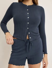 Front view of model wearing the Pointelle Cardigan highlighting the coverage and fit