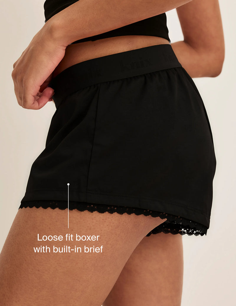 Side view of model wearing the Super Leakproof® Mini Dream Boxer highlighting the coverage and fit. On image text: Loose fit boxer with built-in brief