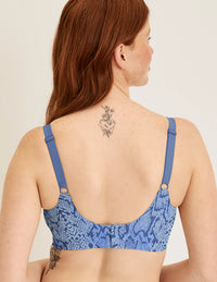 Back view of model wearing the Revolution Busty Bra, highlighting the neckline, strap design, and  silhouette