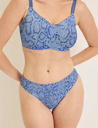 Front view of model wearing the Revolution Busty Bra, highlighting the neckline, strap design, and  silhouette