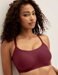 Ashley is a 34DD and wearing KNIX M+ | Dark Cherry