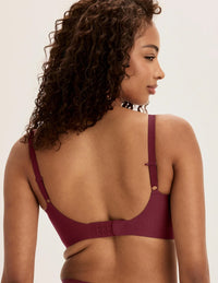 Ashley is a 34DD and wearing KNIX M+ | Dark Cherry