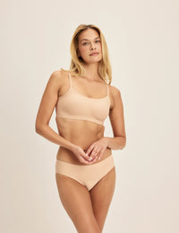 Isabelle is a 32C and wearing KNIX S | Warm Sand