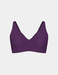 Wireless bra with a V-neckline, adjustable straps, and smooth molded cups, shown front-facing against a light gray background