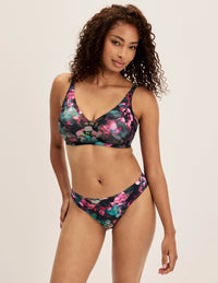 Full-body of model wearing the Revolution V-Neck Bra, highlighting the neckline, strap design, and smooth silhouette