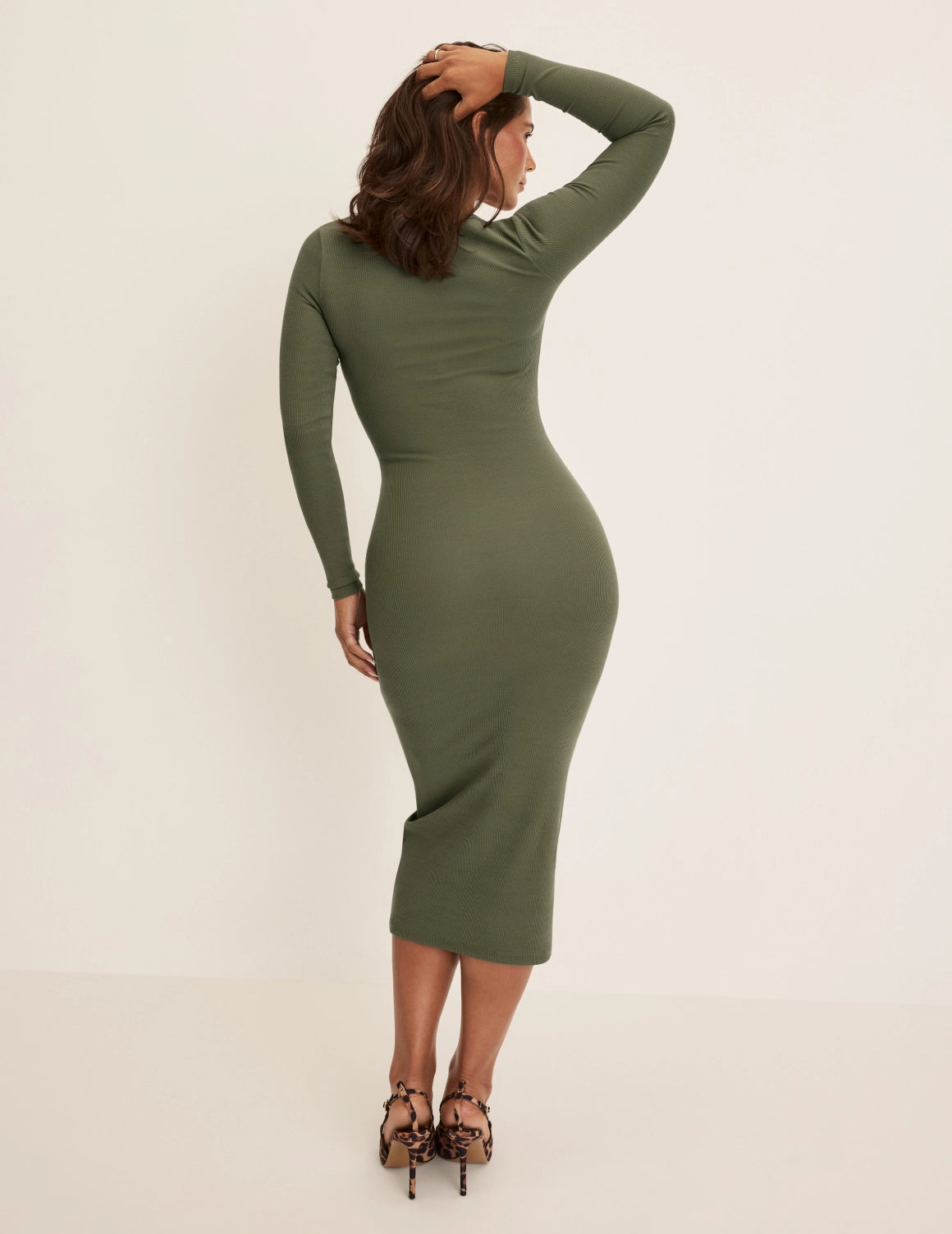 Maya is a 34DDD, 40” hips and wearing KNIX M | Olive
