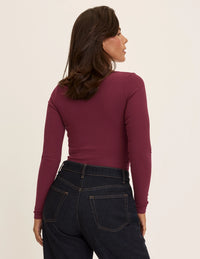 Maya is a 34DDD wearing KNIX M | Dark Cherry