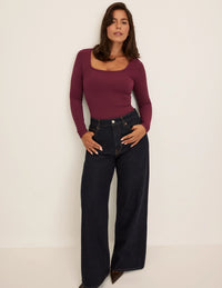 Maya is a 34DDD wearing KNIX M | Dark Cherry