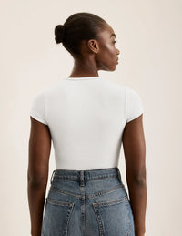 Orlane is a 32DD wearing KNIX S | White