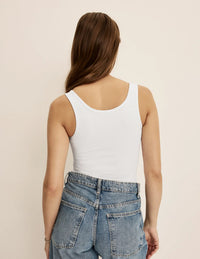 Ashley is a 34C wearing KNIX S | White