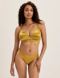 Full-body view of model wearing the Shimmer Stretch Bra, highlighting the neckline, design, and silhouette