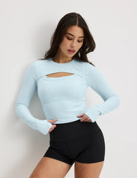 Front view of model wearing the Studio Cutout Bra Top, highlighting the keyhole neckline, flattering design, and silhouette