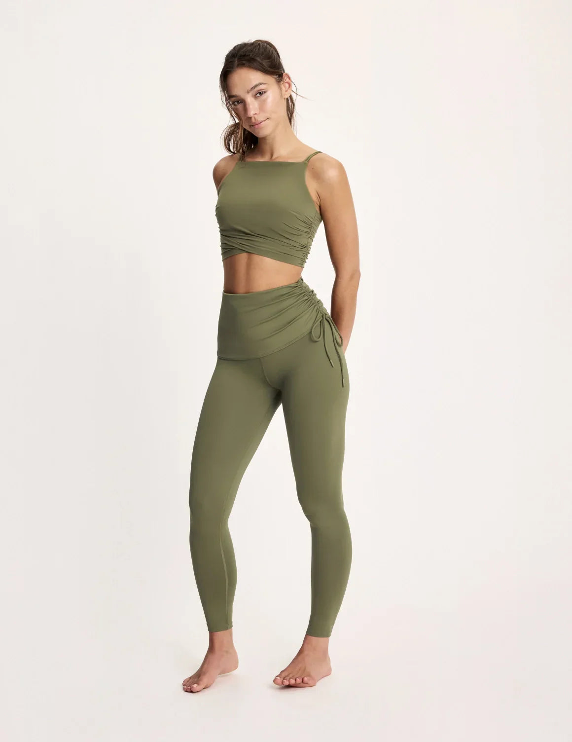 Maya is 5’10”, and wearing KNIX S | Olive