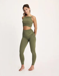 Maya is 5’10”, and wearing KNIX S | Olive