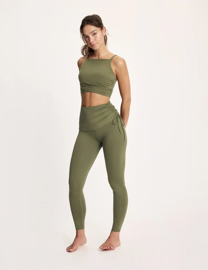 Maya is 5’10”, and wearing KNIX S | Olive