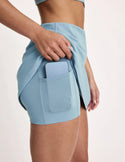 Maya is 5’10”, and wearing KNIX S | Blue Mist