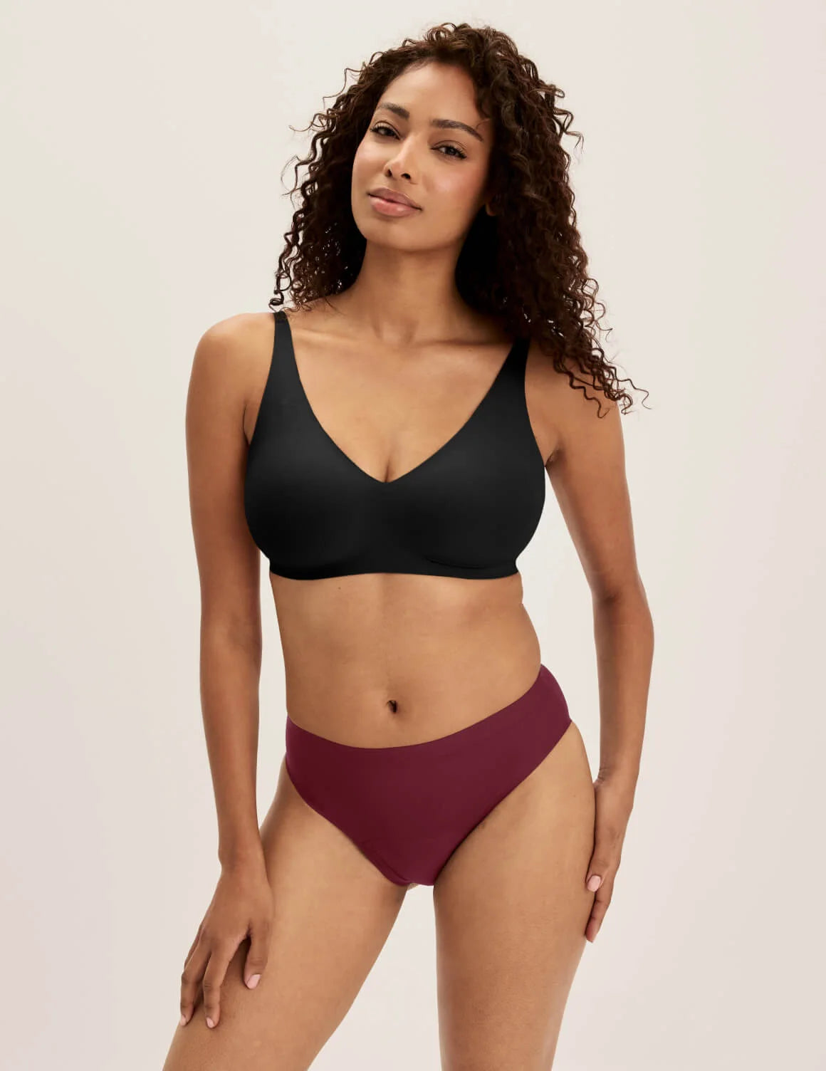 Ashley has 39” hips and wears KNIX S | Dark Cherry