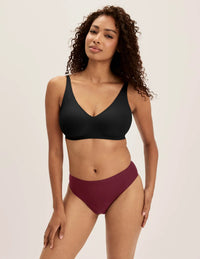 Ashley has 39” hips and wears KNIX S | Dark Cherry