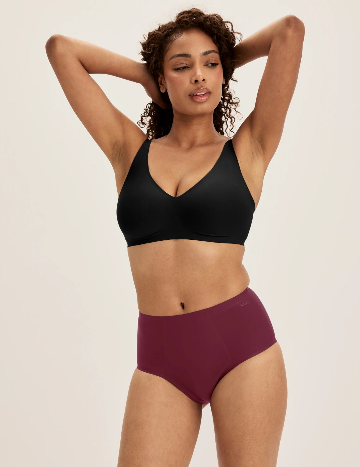 Ashley has 39” hips and wears KNIX S | Dark Cherry