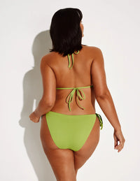 Maya is a 34DDD and is wearing a Knix size M | Chartreuse